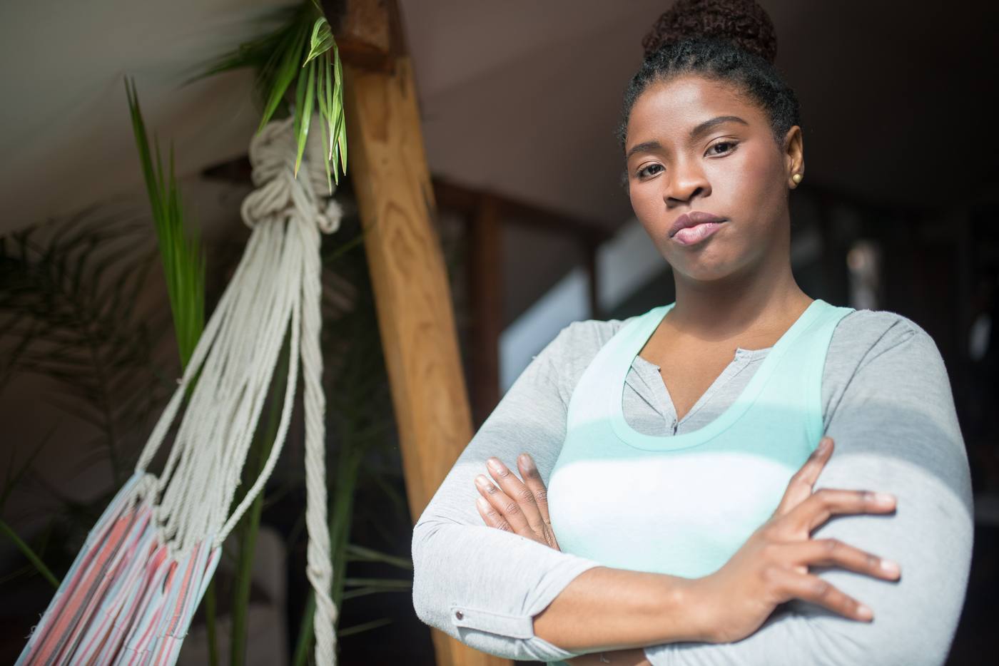A woman standing confidently with arms crossed