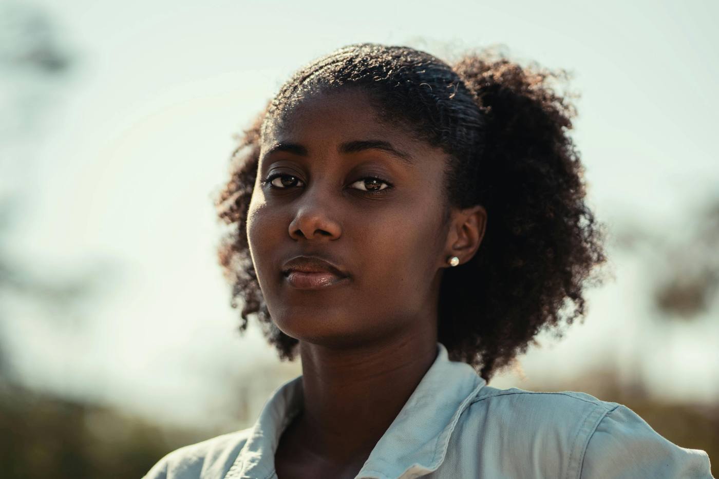 A woman looking thoughtfully into the distance
